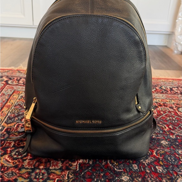 Michael Kors Handbags - Michael Kors Black Leather Backpack with Gold-Tone Accents